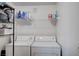 Laundry area includes a washer and dryer, metal shelving and storage space at 9975 Peace Way # 1024, Las Vegas, NV 89147