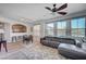 Bright living room featuring a ceiling fan and open floor plan at 9975 Peace Way # 1024, Las Vegas, NV 89147