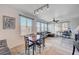 Bright living room features modern lighting, wood-look floors, and a comfortable seating area at 9975 Peace Way # 1024, Las Vegas, NV 89147