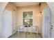 Welcoming tiled front patio with seating and a security gate at 9975 Peace Way # 1024, Las Vegas, NV 89147