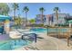 Resort-style pool and spa area surrounded by comfortable seating and lush landscaping at 9975 Peace Way # 1024, Las Vegas, NV 89147