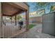 View of the back patio with a covered area, a grassy area and desert landscaping at 1011 Pecos River Ave, Henderson, NV 89002
