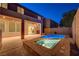Backyard pool and patio, illuminated for nighttime enjoyment and relaxing outdoor living at 1011 Pecos River Ave, Henderson, NV 89002