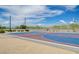 Community basketball court with colorful playing surface, surrounded by desert landscaping and clear sky at 1011 Pecos River Ave, Henderson, NV 89002