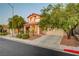Inviting two-story home featuring a well-manicured front yard and a two-car garage at 1011 Pecos River Ave, Henderson, NV 89002