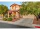 Charming two-story home with desert landscaping, covered porch, and two-car garage at 1011 Pecos River Ave, Henderson, NV 89002