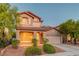 Charming two-story home with desert landscaping, covered porch, and two-car garage at 1011 Pecos River Ave, Henderson, NV 89002