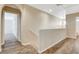 Spacious upstairs hallway with wood-look flooring provides seamless transition between rooms at 1011 Pecos River Ave, Henderson, NV 89002
