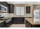 Kitchen featuring stainless steel appliances, tiled backsplash and granite countertops at 1011 Pecos River Ave, Henderson, NV 89002