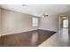 Spacious living room featuring hardwood floors, neutral walls, and modern ceiling fan at 1011 Pecos River Ave, Henderson, NV 89002