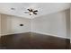 Large living room with hardwood floors and ceiling fan, ready for entertaining or relaxing at 1011 Pecos River Ave, Henderson, NV 89002