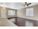 Well-lit living room featuring hardwood floors, large windows, and a welcoming entrance at 1011 Pecos River Ave, Henderson, NV 89002