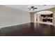Spacious living room with hardwood floors leading to an open kitchen area at 1011 Pecos River Ave, Henderson, NV 89002