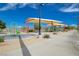 Community playground featuring a swing set and covered play structure, perfect for Gathering fun at 1011 Pecos River Ave, Henderson, NV 89002