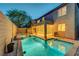 Inviting backyard oasis featuring a sparkling pool, relaxing spa, and covered patio for outdoor enjoyment at 1011 Pecos River Ave, Henderson, NV 89002