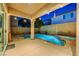 Outdoor patio area with a refreshing pool and spa, perfect for relaxing evenings under string lights at 1011 Pecos River Ave, Henderson, NV 89002