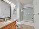 Bathroom featuring tile floors, granite countertops, and a shower-tub combo at 10205 Camborne Ave # 104, Las Vegas, NV 89144