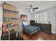 Bedroom with hardwood floors, window shutters and neat storage at 10205 Camborne Ave # 104, Las Vegas, NV 89144
