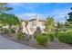 Charming condo with a well-manicured yard and cozy covered staircase leading to the upper level entry at 10205 Camborne Ave # 104, Las Vegas, NV 89144