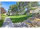 Well-manicured green space surrounded by mature trees and landscaping at 10205 Camborne Ave # 104, Las Vegas, NV 89144