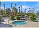 Inviting hot tub with nearby seating offers a relaxing outdoor experience at 10205 Camborne Ave # 104, Las Vegas, NV 89144
