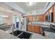 Well-equipped kitchen featuring stainless steel appliances and granite countertops, seamlessly connecting to the dining area at 10205 Camborne Ave # 104, Las Vegas, NV 89144