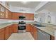 Modern kitchen featuring stainless steel appliances, granite countertops, and ample cabinet space at 10205 Camborne Ave # 104, Las Vegas, NV 89144