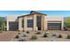 Contemporary home boasts clean lines, desert landscaping, and a two-car garage at 10809 Agate Cliffs Ave, Las Vegas, NV 89135