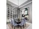 Elegant dining room with modern lighting, and an art display, perfect for entertaining guests at 10848 Vista Altura Ave, Las Vegas, NV 89135