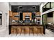 Modern kitchen featuring a waterfall island, stainless steel appliances, and a sleek design at 10848 Vista Altura Ave, Las Vegas, NV 89135