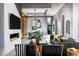 Elegant living room with a fireplace, dining table, modern lighting, and stylish décor at 10848 Vista Altura Ave, Las Vegas, NV 89135