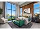 Bright main bedroom features floor-to-ceiling windows, accent wall, and modern decor for a relaxing retreat at 10848 Vista Altura Ave, Las Vegas, NV 89135