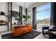Modern office features unique shelving, an eye-catching desk and great natural lighting at 10848 Vista Altura Ave, Las Vegas, NV 89135