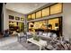 Stylish outdoor patio with modern furnishings and seamless access to the home's interior living spaces at 10848 Vista Altura Ave, Las Vegas, NV 89135