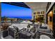 Elegant covered patio with comfortable seating, mountain views, and seamless indoor-outdoor living at 10848 Vista Altura Ave, Las Vegas, NV 89135