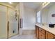 Well-lit bathroom offers a luxurious glass shower, separate soaking tub and ample counter space at 10952 Porto Foxi St, Las Vegas, NV 89141