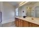 Bathroom boasts dual sinks, a soaking tub, and separate shower, perfect for a relaxing experience at 10952 Porto Foxi St, Las Vegas, NV 89141