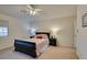 Bedroom with a ceiling fan, a neutral color scheme, and simple furnishings at 10952 Porto Foxi St, Las Vegas, NV 89141