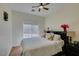 Cozy bedroom with vaulted ceiling, ceiling fan, and lots of natural light at 10952 Porto Foxi St, Las Vegas, NV 89141