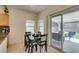 Cozy dining area with access to the outdoor patio through sliding glass doors at 10952 Porto Foxi St, Las Vegas, NV 89141