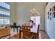 Bright dining and living room with wood floors and staircase to the second story at 10952 Porto Foxi St, Las Vegas, NV 89141