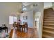 Dining room with hardwood floors, a chandelier, and direct access to stairs at 10952 Porto Foxi St, Las Vegas, NV 89141