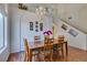 Dining area with wooden table, chandelier, and staircase at 10952 Porto Foxi St, Las Vegas, NV 89141