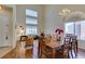 Bright dining area with wooden table, chandelier, and view of living room at 10952 Porto Foxi St, Las Vegas, NV 89141