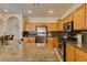 Bright kitchen showcases stainless steel appliances, granite countertops, and recessed lighting at 10952 Porto Foxi St, Las Vegas, NV 89141