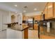 Well-lit kitchen features granite counters, stainless appliances, and ample cabinet space at 10952 Porto Foxi St, Las Vegas, NV 89141