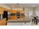Open kitchen with granite counters, stainless appliances and attached breakfast nook at 10952 Porto Foxi St, Las Vegas, NV 89141