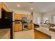 Charming kitchen with stainless steel appliances and stylish granite countertops at 10952 Porto Foxi St, Las Vegas, NV 89141