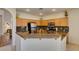 Cozy kitchen featuring stainless steel appliances, granite countertops, and wooden cabinets at 10952 Porto Foxi St, Las Vegas, NV 89141