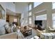 Bright living room with high ceilings and large windows offering natural light at 10952 Porto Foxi St, Las Vegas, NV 89141